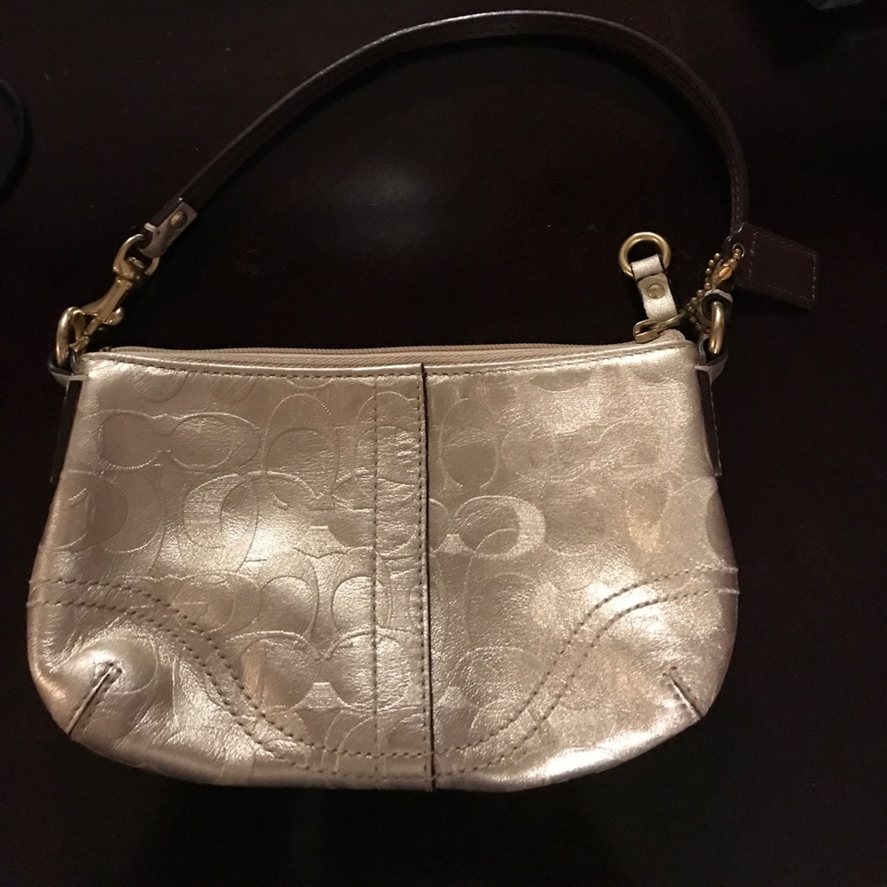 Coach - gold wristlet